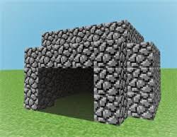 Original Minecraft Cave Game prototype screenshot showing a blocky stone cave structure on grass under a blue sky