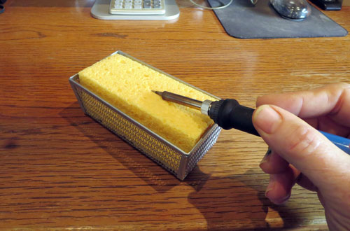 Soldering iron tip cleaner for removing oxidation